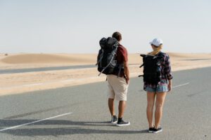 couple standing on desert road